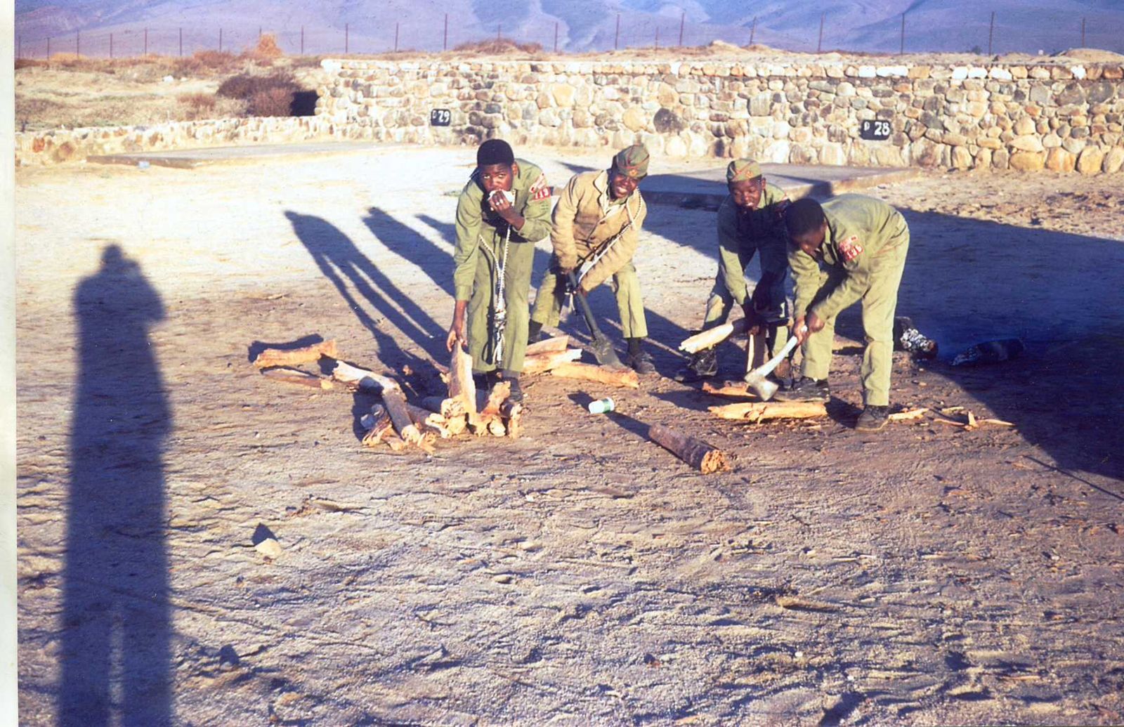 Scouts building a fire on dry ground in Mexico
